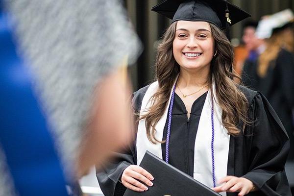 Young student smiling and happy at graduation 